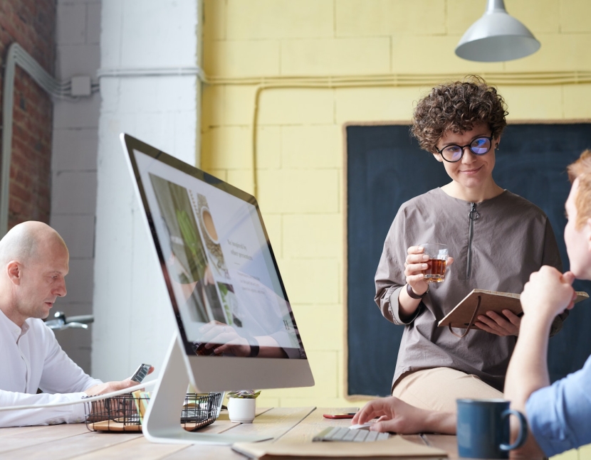 Man in Blue Collared Top Using Imac Indoors